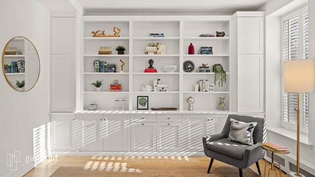 sitting room with light hardwood / wood-style floors