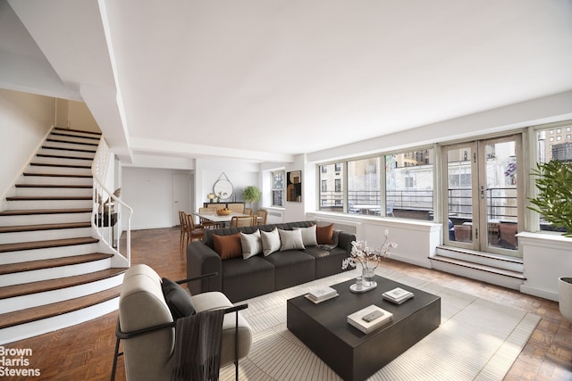 living room featuring parquet floors and a wealth of natural light