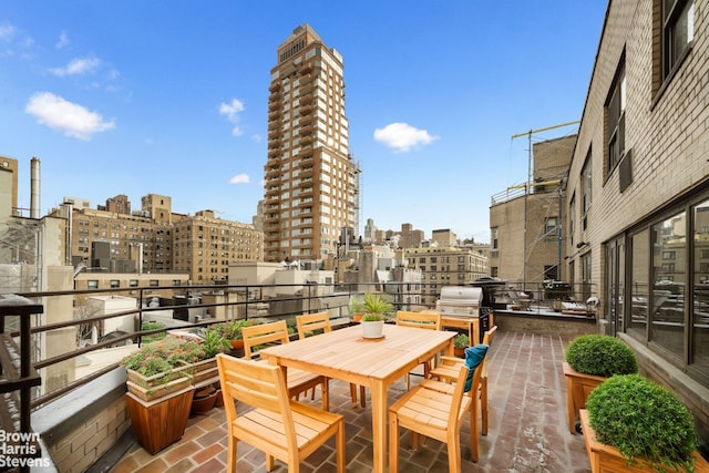 view of patio featuring a city view and a balcony