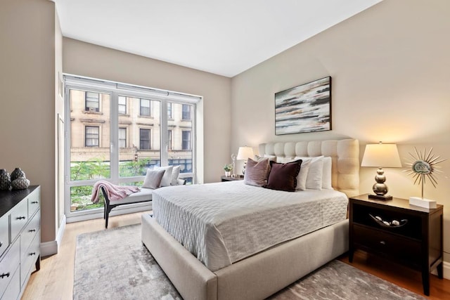 bedroom with light wood-type flooring