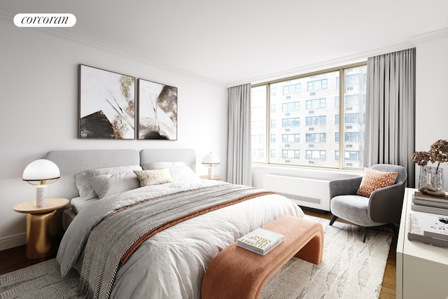 bedroom featuring visible vents, wood finished floors, radiator, crown molding, and baseboards