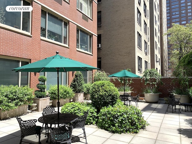 view of patio featuring outdoor dining area