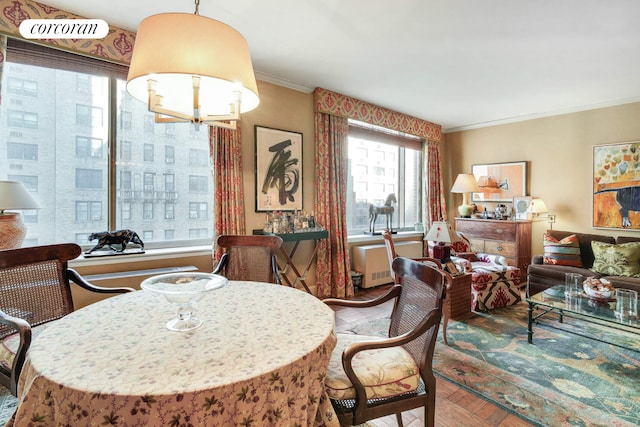 dining area featuring crown molding