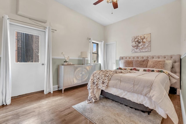 bedroom featuring a ceiling fan and wood finished floors