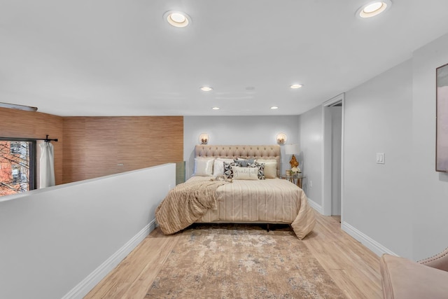 bedroom featuring recessed lighting, baseboards, and wood finished floors