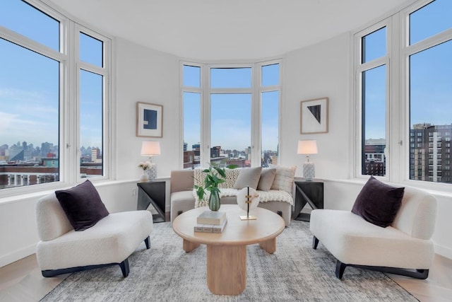 living area with hardwood / wood-style flooring and a wealth of natural light