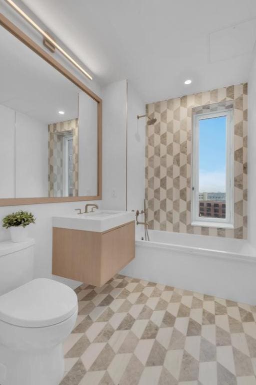 full bathroom featuring vanity, toilet, and shower / bathing tub combination