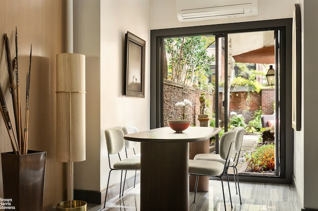 dining space with a wall mounted air conditioner