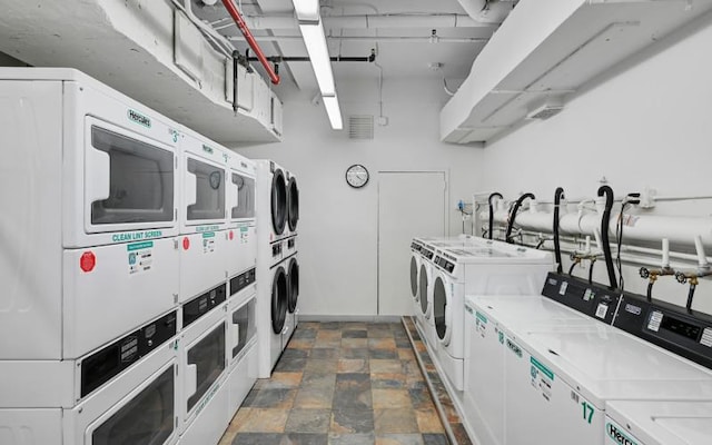 washroom with independent washer and dryer and stacked washer and dryer