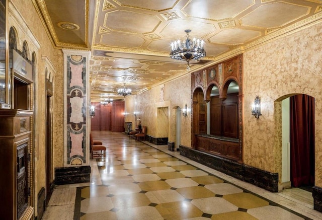 hall with crown molding and a chandelier