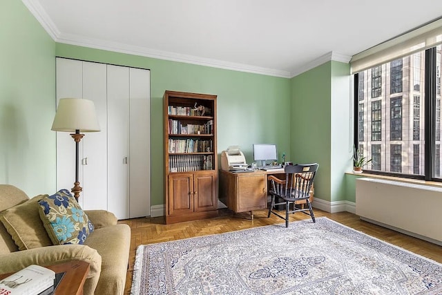 office area with baseboards and ornamental molding