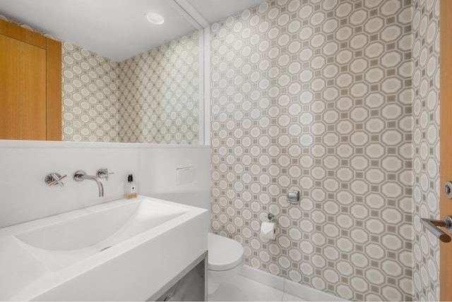 bathroom with toilet and vanity