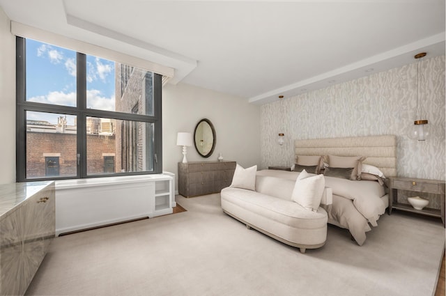 carpeted bedroom with wallpapered walls and multiple windows