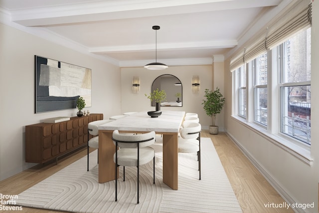 dining area with crown molding, beamed ceiling, and light wood-type flooring