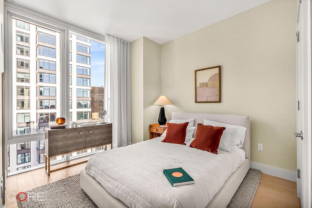 bedroom with light hardwood / wood-style flooring