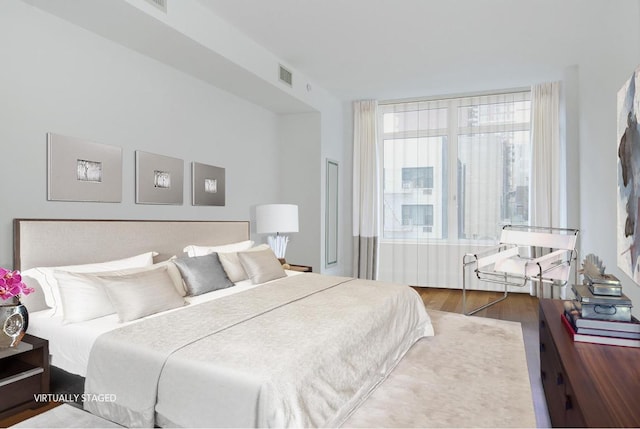 bedroom featuring hardwood / wood-style floors