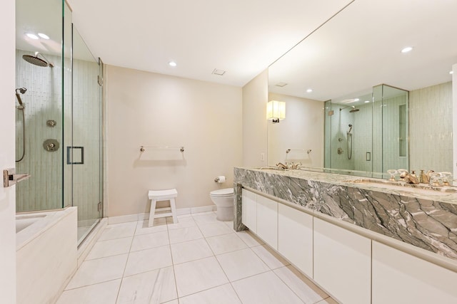 full bathroom with toilet, a shower stall, vanity, tile patterned flooring, and baseboards