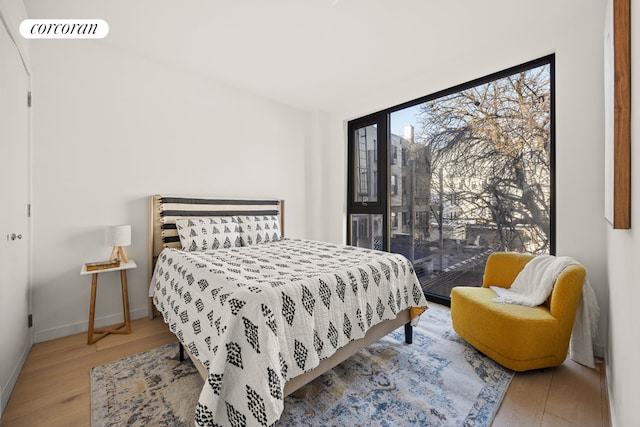 bedroom with light hardwood / wood-style floors