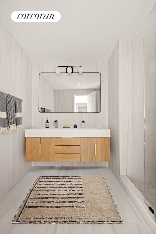 bathroom with vanity and walk in shower