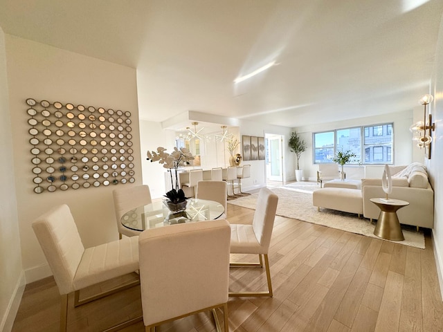 dining room featuring baseboards and wood finished floors