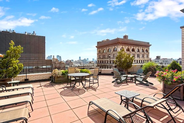 view of patio / terrace featuring a city view