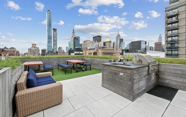 view of patio featuring exterior kitchen, outdoor lounge area, and a grill