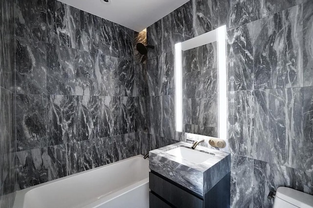 130 William St Unit 33C, New York City, NY 10038 - full bathroom with tile walls, bathtub / shower combination, vanity, and toilet