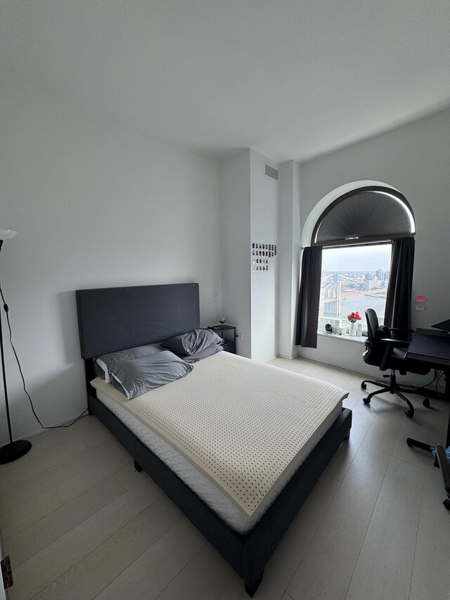 bedroom with light hardwood / wood-style flooring