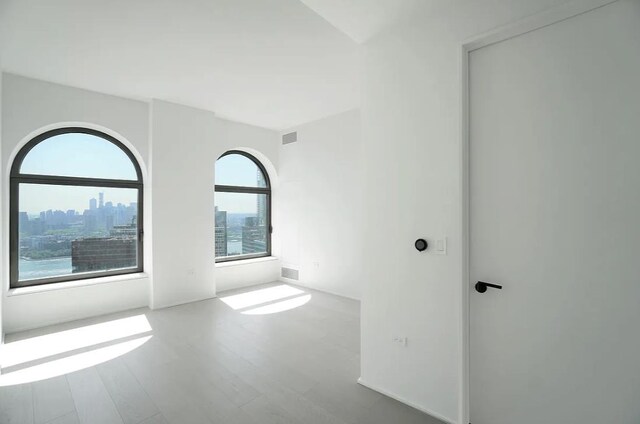 empty room featuring hardwood / wood-style floors