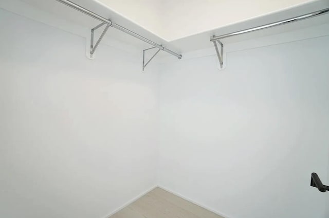 130 William St Unit 33C, New York City, NY 10038 - spacious closet with light wood-style floors