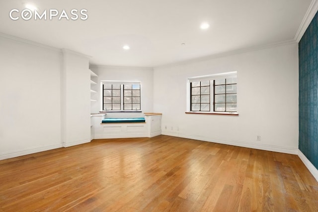 unfurnished room featuring crown molding, recessed lighting, baseboards, and wood finished floors