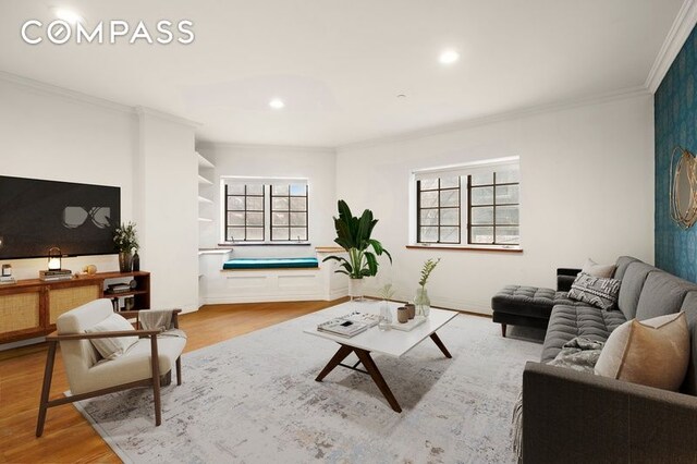 living room with recessed lighting, crown molding, and wood finished floors