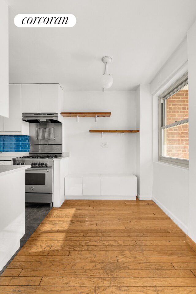 living room featuring sink and light wood-type flooring