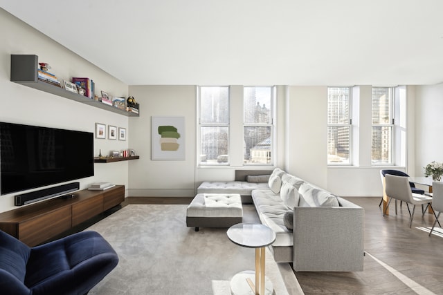 living room with plenty of natural light and hardwood / wood-style floors