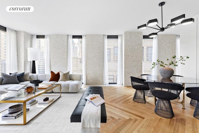 living room with parquet flooring and an inviting chandelier