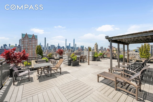 wooden deck with a city view