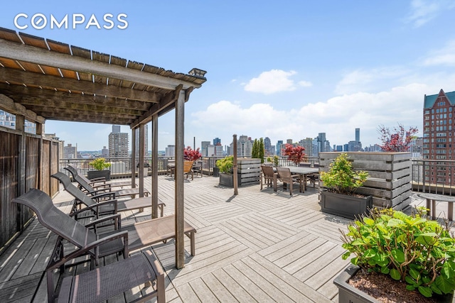 wooden terrace with a city view