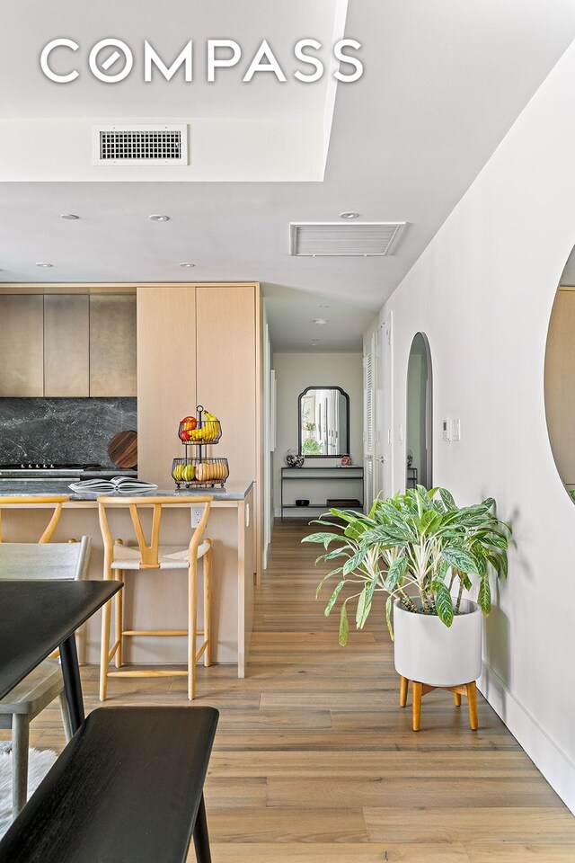 dining area with light hardwood / wood-style floors