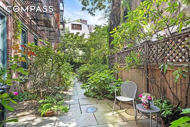 view of patio featuring fence