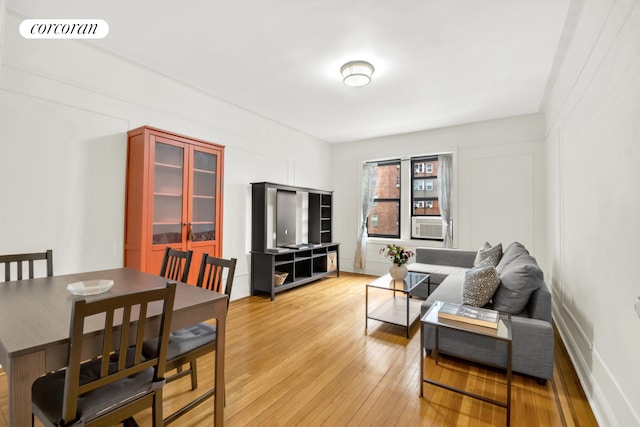 living room featuring visible vents and light wood-type flooring