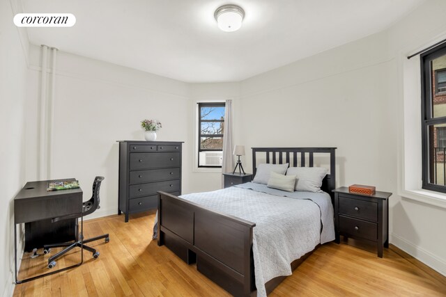 bedroom with wood-type flooring