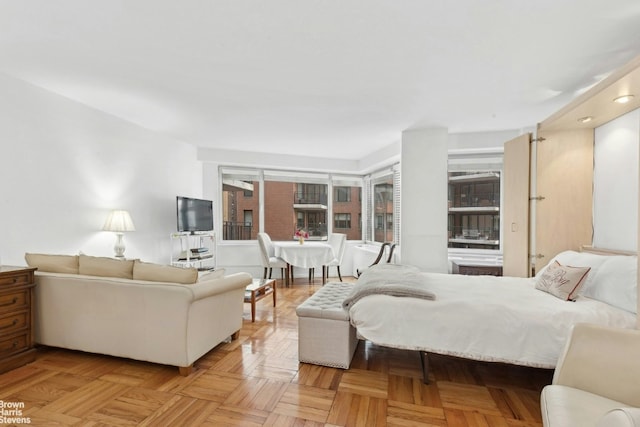 bedroom with light parquet flooring