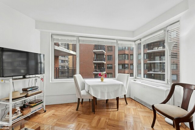 dining room featuring light parquet flooring