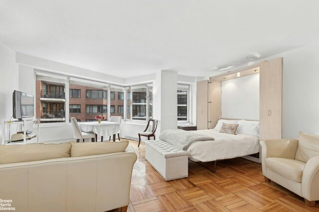 bedroom featuring light parquet floors