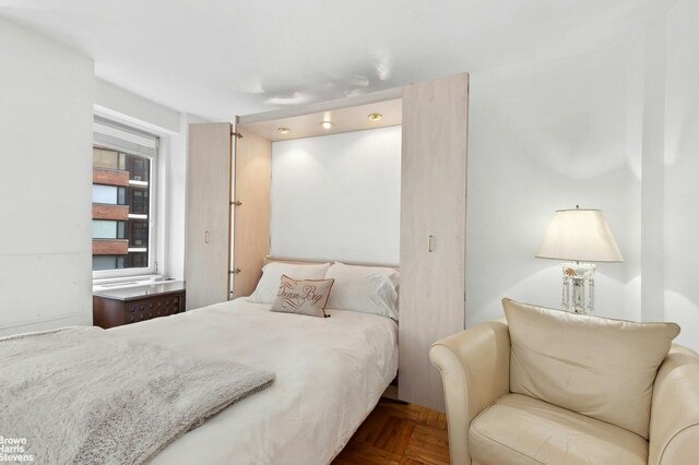 bedroom featuring parquet floors