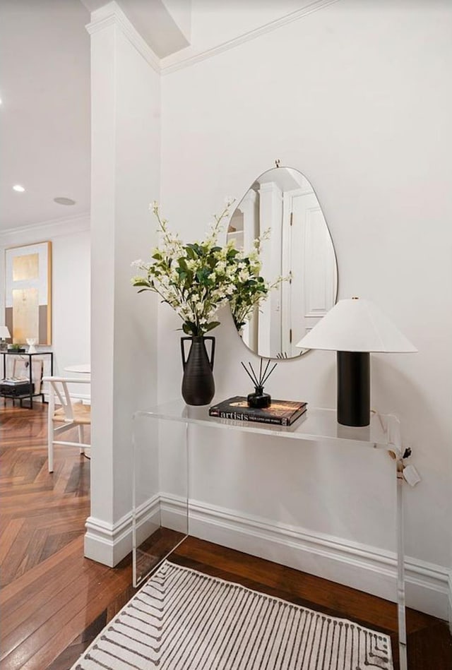 room details featuring crown molding, recessed lighting, parquet flooring, and baseboards