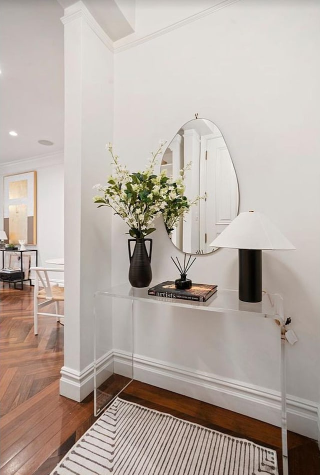 detailed view of baseboards, ornamental molding, parquet flooring, and recessed lighting