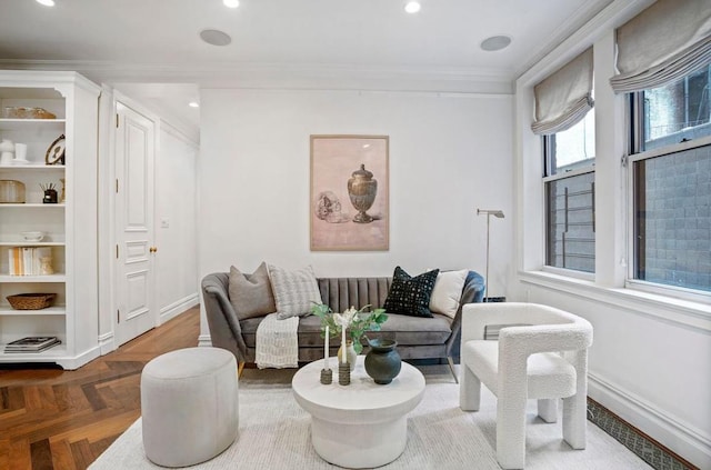 living room with crown molding and parquet floors