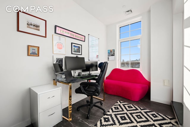 home office with baseboards and visible vents