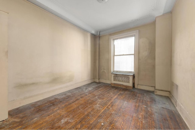 unfurnished room featuring crown molding and dark hardwood / wood-style flooring